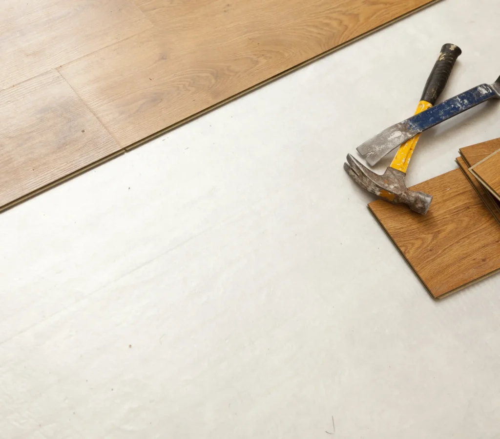 hammer-and-pry-bar-with-laminate-flooring-abstract-2026-01-05-00-25-54-utc